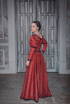 Beautiful woman in red medieval dress