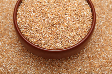 Wheat groats in bowl