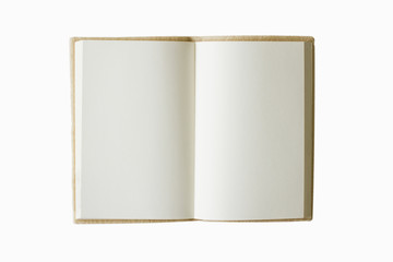 blank book open on a brown textured surface