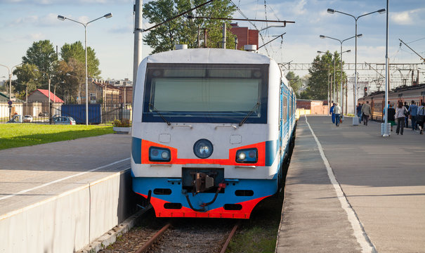 Modern suburban electric train standing at the station in Russia