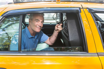 Senior Man Taking a Cab in New York