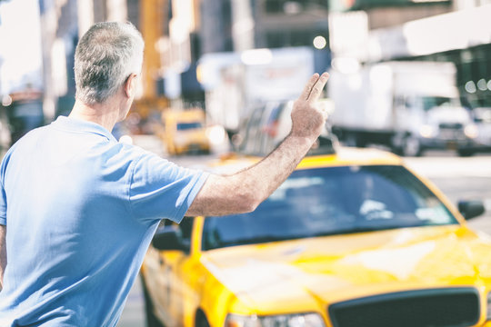 Senior Man Calling A Cab In New York