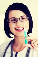 Happy medical doctor or nurse with syringe