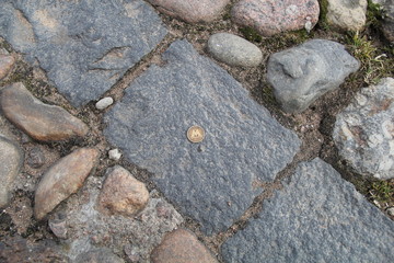 coin on the road