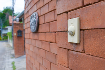 doorbell on the brick wall of a house