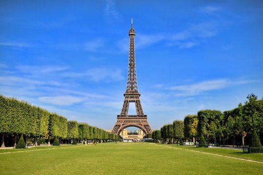 Eiffel Tower, iconic Paris landmark with vibrant blue sky