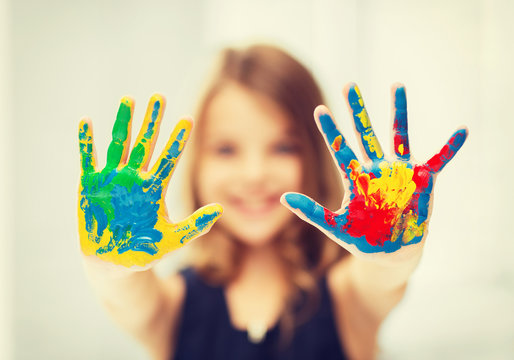 girl showing painted hands