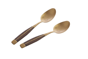 two gold and wooden spoon on white background