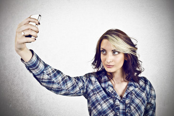 Girl taking self photo with smart phone