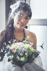 Beauty bride holding bouquet.