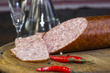 sausages on a wooden plate with vegetables in a restaurant