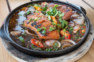 Thai Spicy grilled pork on hot plate