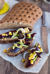 vegetarian sandwich with vegetables on a wooden background