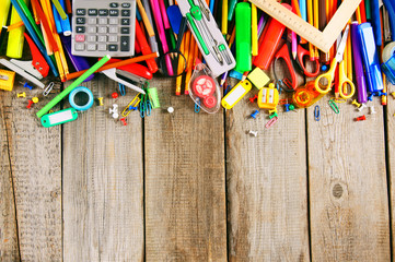 School tools. On wooden background.
