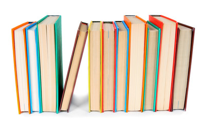 Multi-coloured books. On white background.