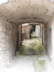 Light and airy alleyway, narrow street, in ancient village. Ital