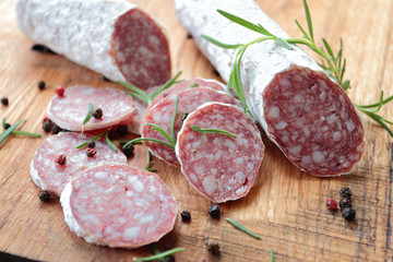Salami sausage on a wooden cutting board