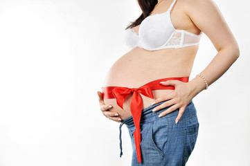 Half-length portrait of a pregnant woman with red ribbon and bow