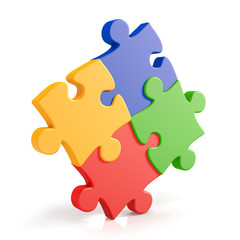 Four assembling colorful puzzle pieces - obrazy, fototapety, plakaty
