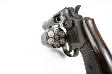 Black revolver gun isolated on white background © Delicious