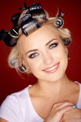 Beautiful blond with her hair in curlers