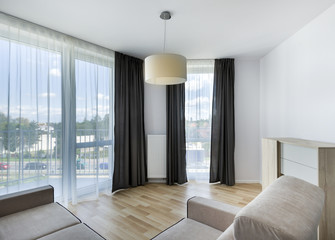 Big windows in modern living room apartment