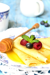 Flapjacks with berries and honey.