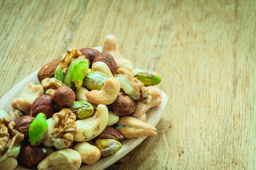 Varieties of nuts: cashew, pistachio, almond.