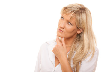 Thinking mature woman looking up isolated