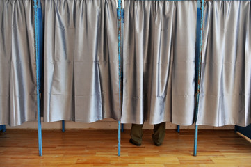 Man inside a voting booth