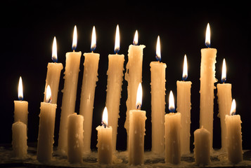 Burning candles in the darkness 2