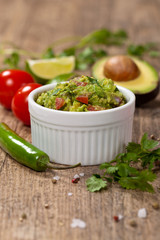 Guacamole with avocado, lime, tomato and cilantro