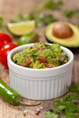 Guacamole with avocado, lime, tomato and cilantro