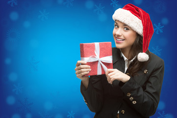 business woman in santa hat holding gift