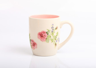 Mug with rose flower pattern isolated
