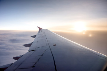 Fototapeta na wymiar Wing of an airplane on the sky