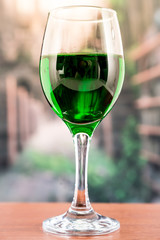glass with green liquid cocktail
