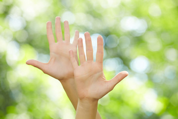 woman hands over nature background