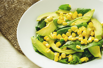 salad with corn, spinach and avocado