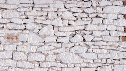 Part of a white stone wall, for background or texture.