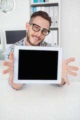 Nerdy businessman showing tablet pc screen