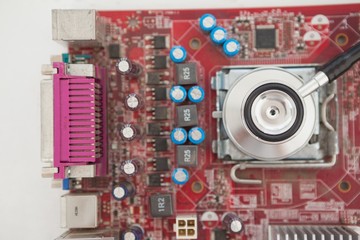 Stethoscope lying on cpu on table