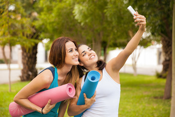 Friends taking a selfie before their yoga practice