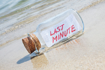 Message in bottle "Last minute". Creative summer break concept.