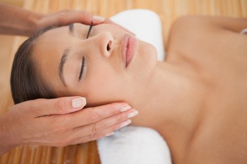 Obraz na płótnie Canvas Beautiful brunette enjoying a head massage