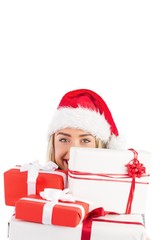 Festive blonde holding pile of gifts