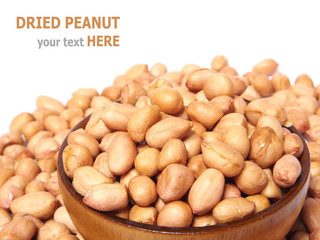 Dried peanut in wooden bowl isolated on white background