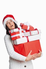 Shocked woman with christmas presents