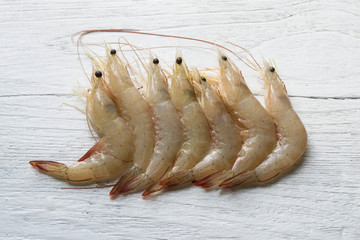 raw shrimp on white wooden