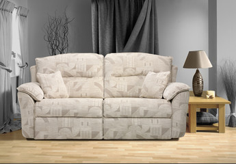 cream sofa in modern living room with cushions